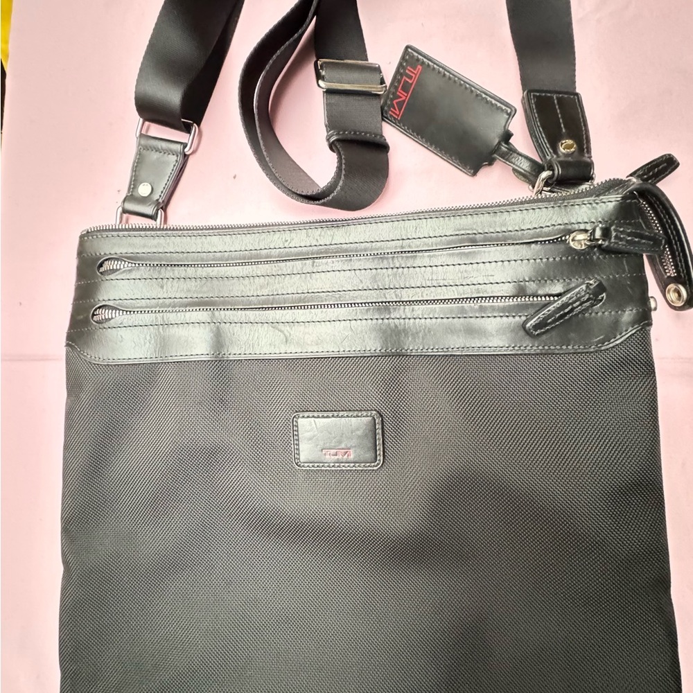 Black Tumi cross body bag.